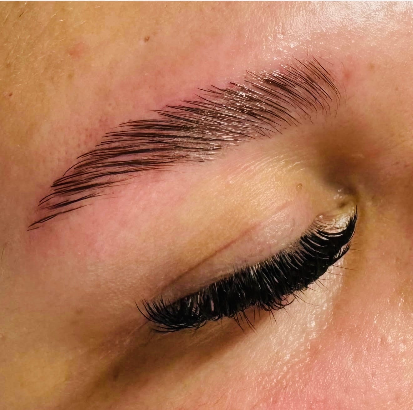 Full, lifted lash extensions and a shaped brow